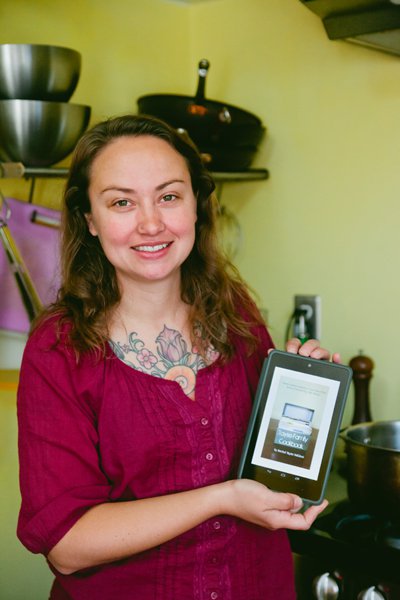 Columbus Resident Rachel Tayse Baillieul shows off her cookbook on her Kindle.