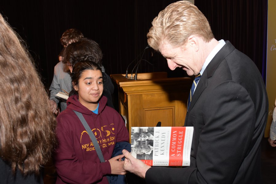 Patrick Kennedy Signing Student's Books_courtesyofLornSpolter.jpg
