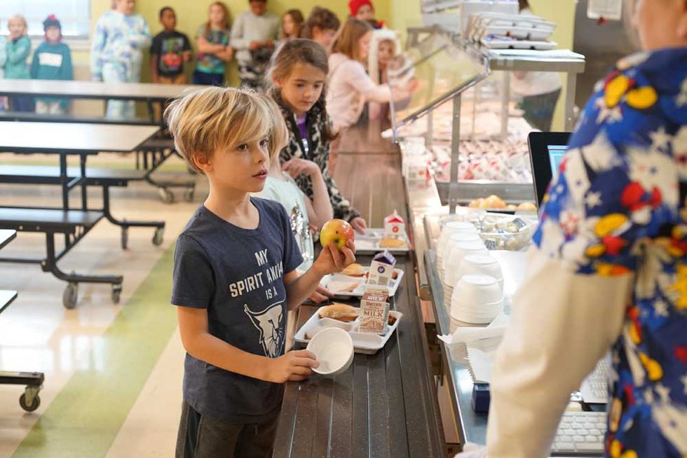 Second grader Miles Beale makes a healthy choice during lunchtime at Stevenson Elementary.  (Photo courtesy of Marc Alter).jpg