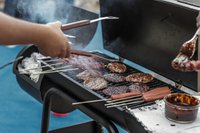 person-grilling-sausage-and-meat-1857732 (1).jpg
