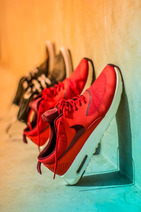 focus-photography-of-pair-of-red-nike-running-shoes-1027130.jpg