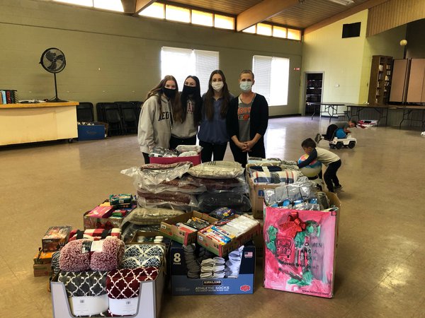 Anna and friends with donations. Photo courtesy of Tanya Rossier.jpeg