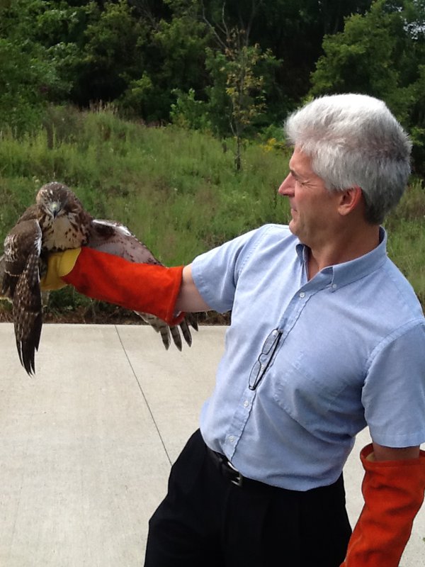 David Hague holds up a bird at Coyote Run. The preserve is heavily populated by a plethora of different types of birds. Photo by David Hague.JPG